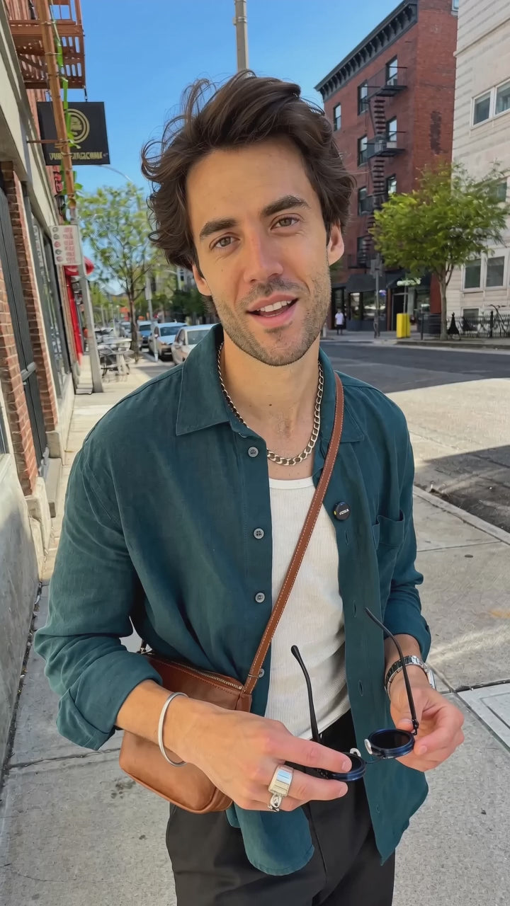 Adjustable tint sunglasses – presenter shows how to twist the lens